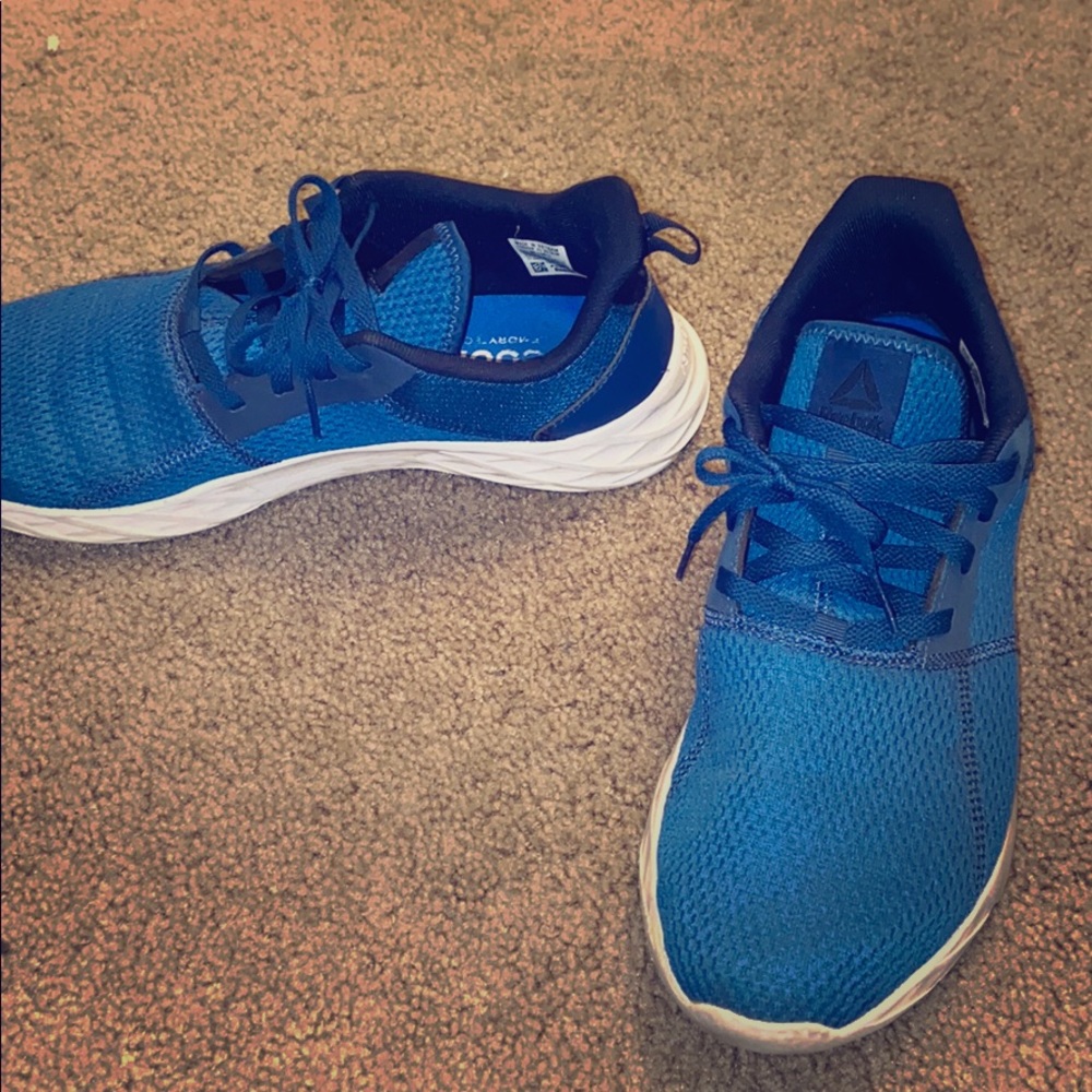 Blue and white Reebok shoes